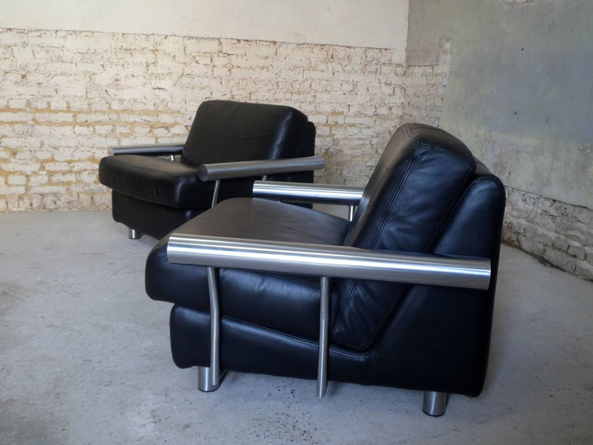 pair of armchairs, black leather & stainless steel, 1990