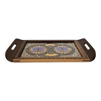 Wooden vintage plateau with butterfly decoration.