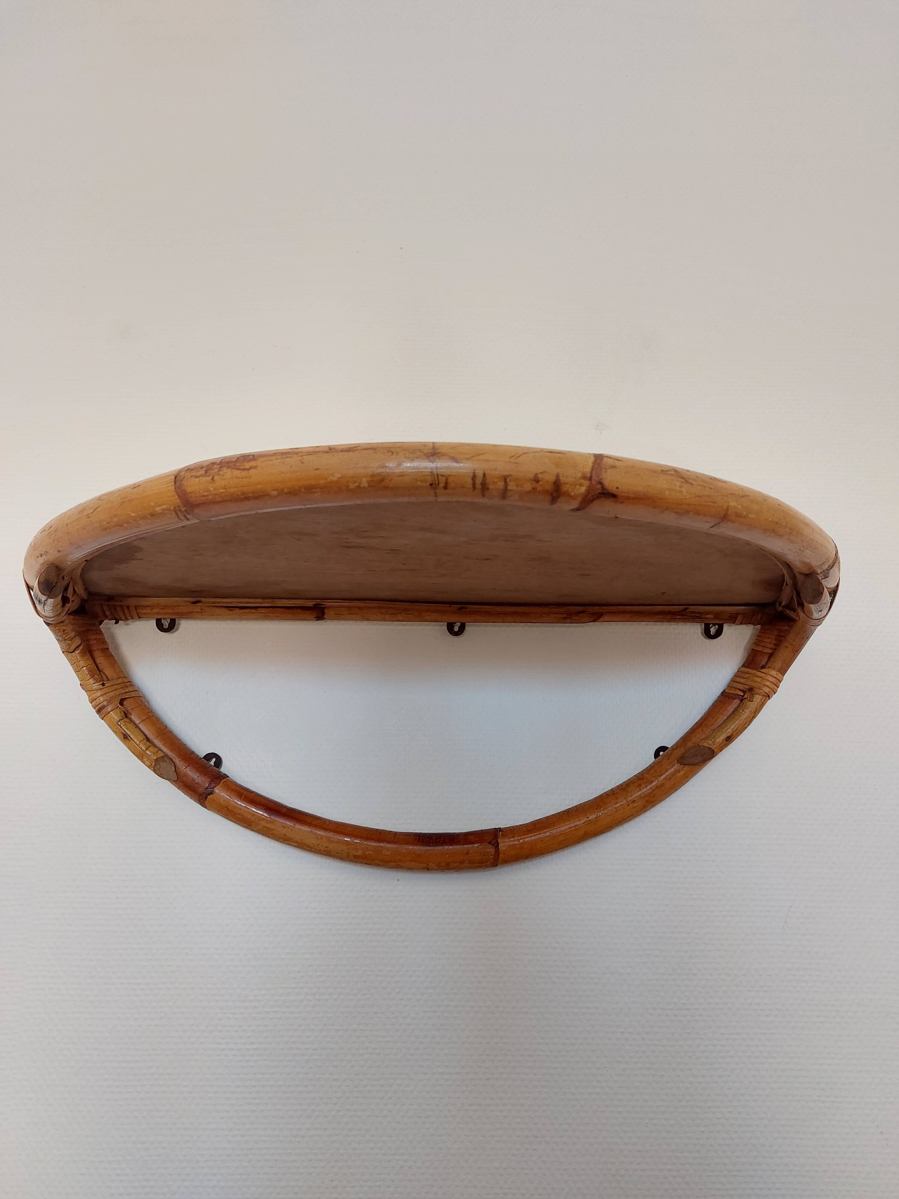 Vintage half-moon rattan shelf