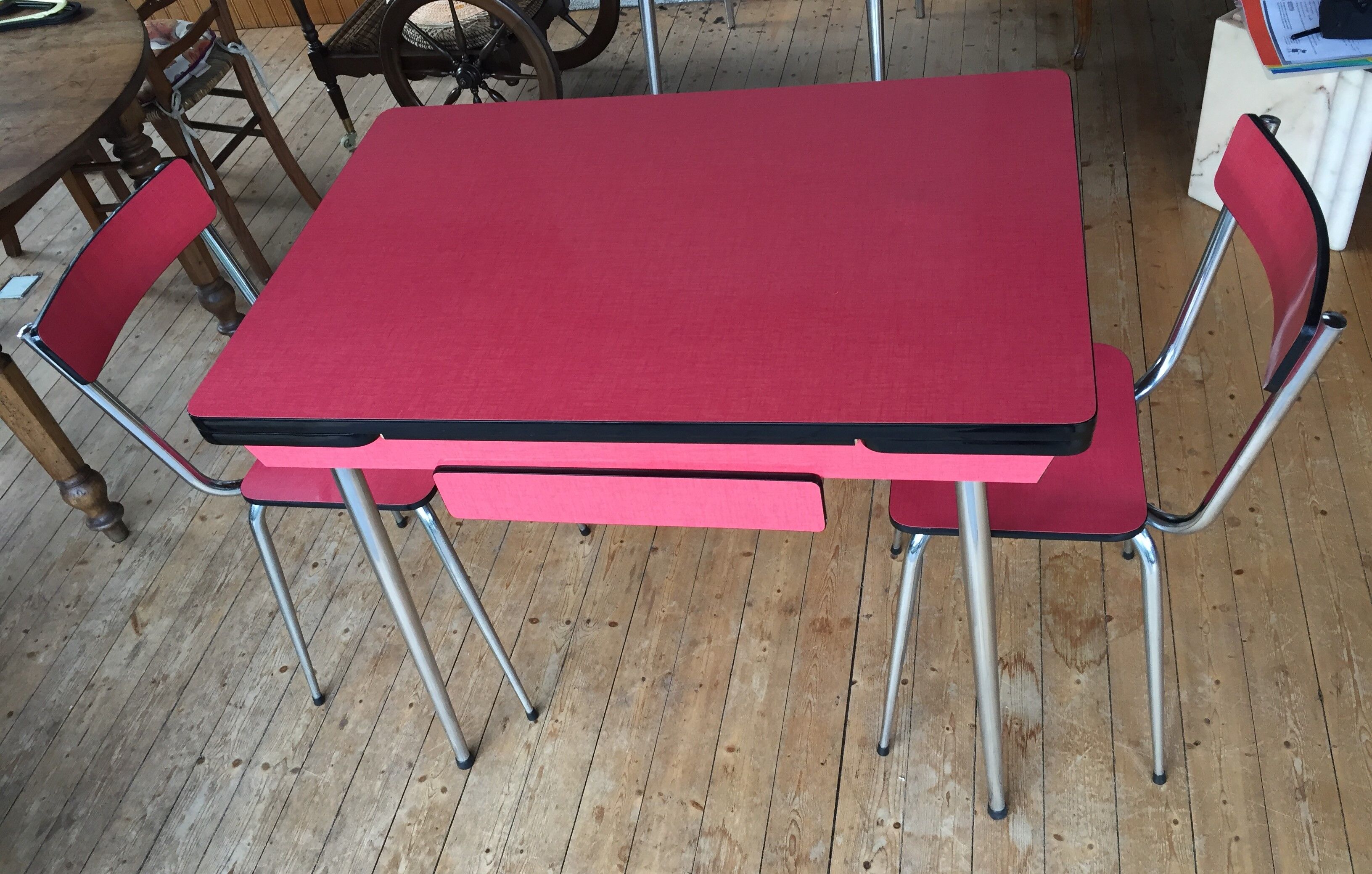 Table set and 2 vintage vintage pale red formica chairs