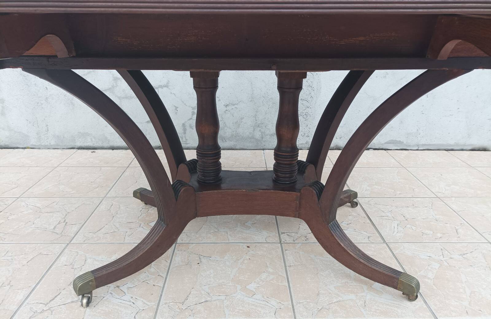 19th-century English style mahogany drop-leaf table.