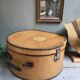 Hat box with leather handle