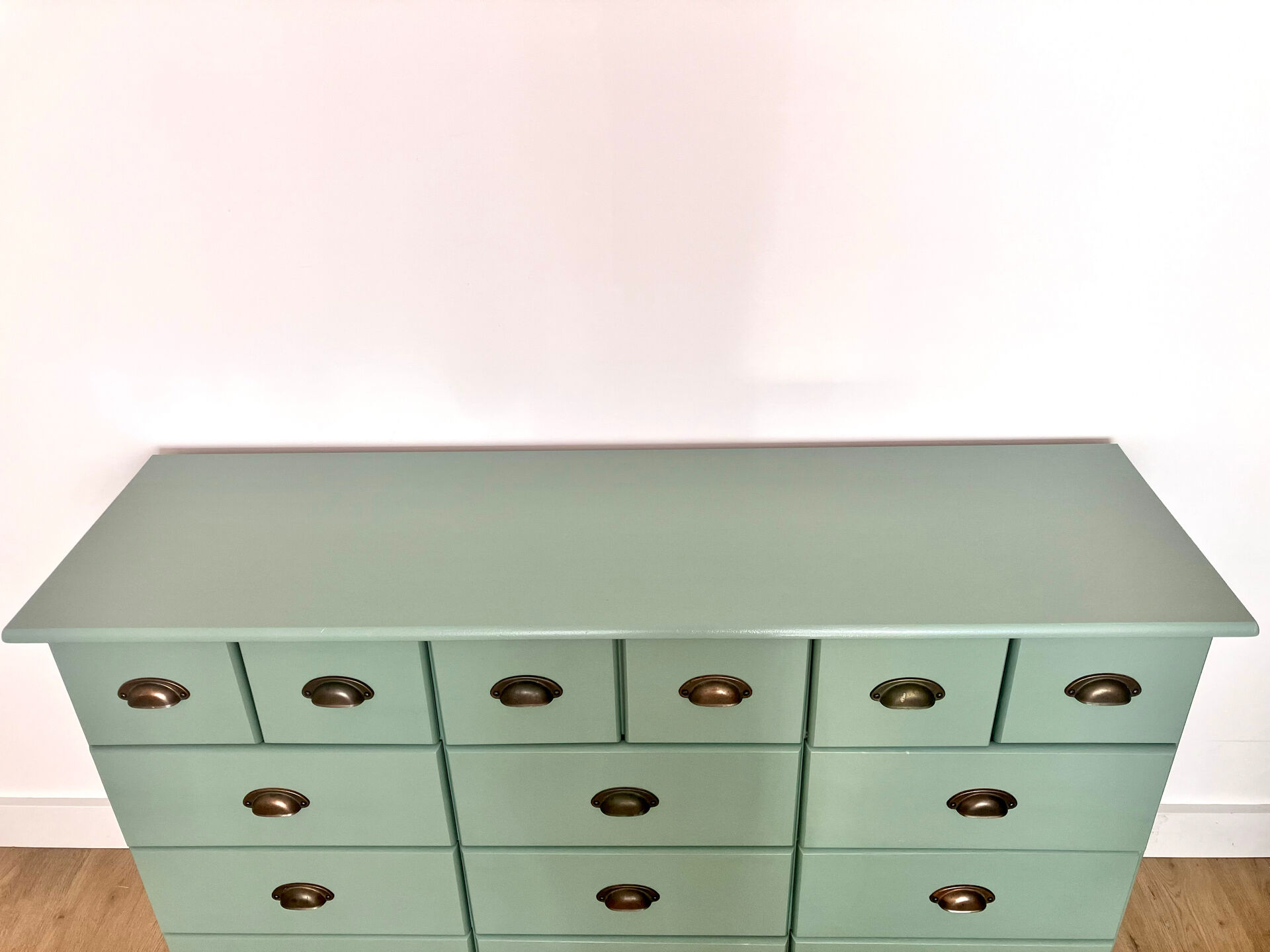 Low buffet with patinated gold handles.