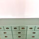 Low buffet with patinated gold handles.