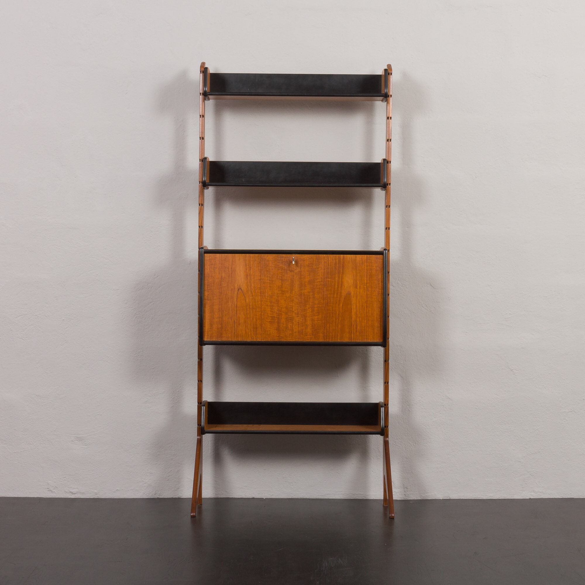 Scandinavian free standing vertical bookcase with a secrtetaire or home office wall unit model Ergo,