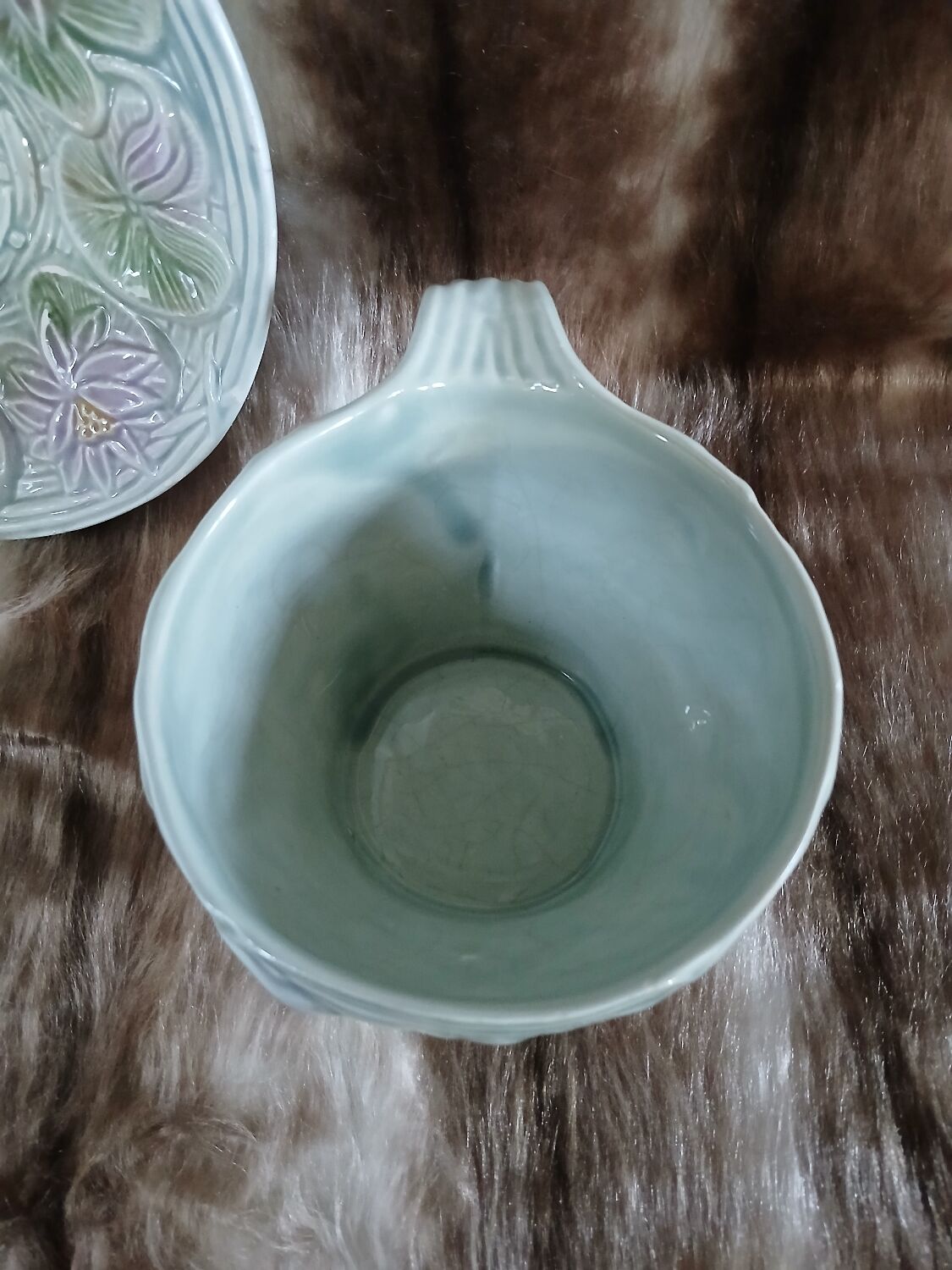 Antique cup and saucer in majolica.