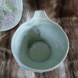 Antique cup and saucer in majolica.