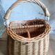 Covered rattan basket for lunch on 50s grass