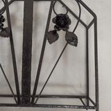 Pink-decorated iron umbrella door.