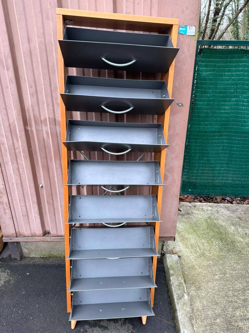 Scandinavian shoe storage cabinet in grey wood and metal.