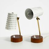 A pair of mid-century modern bedside lamps with perforated metal shades