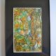 Framed abstract painting under glass