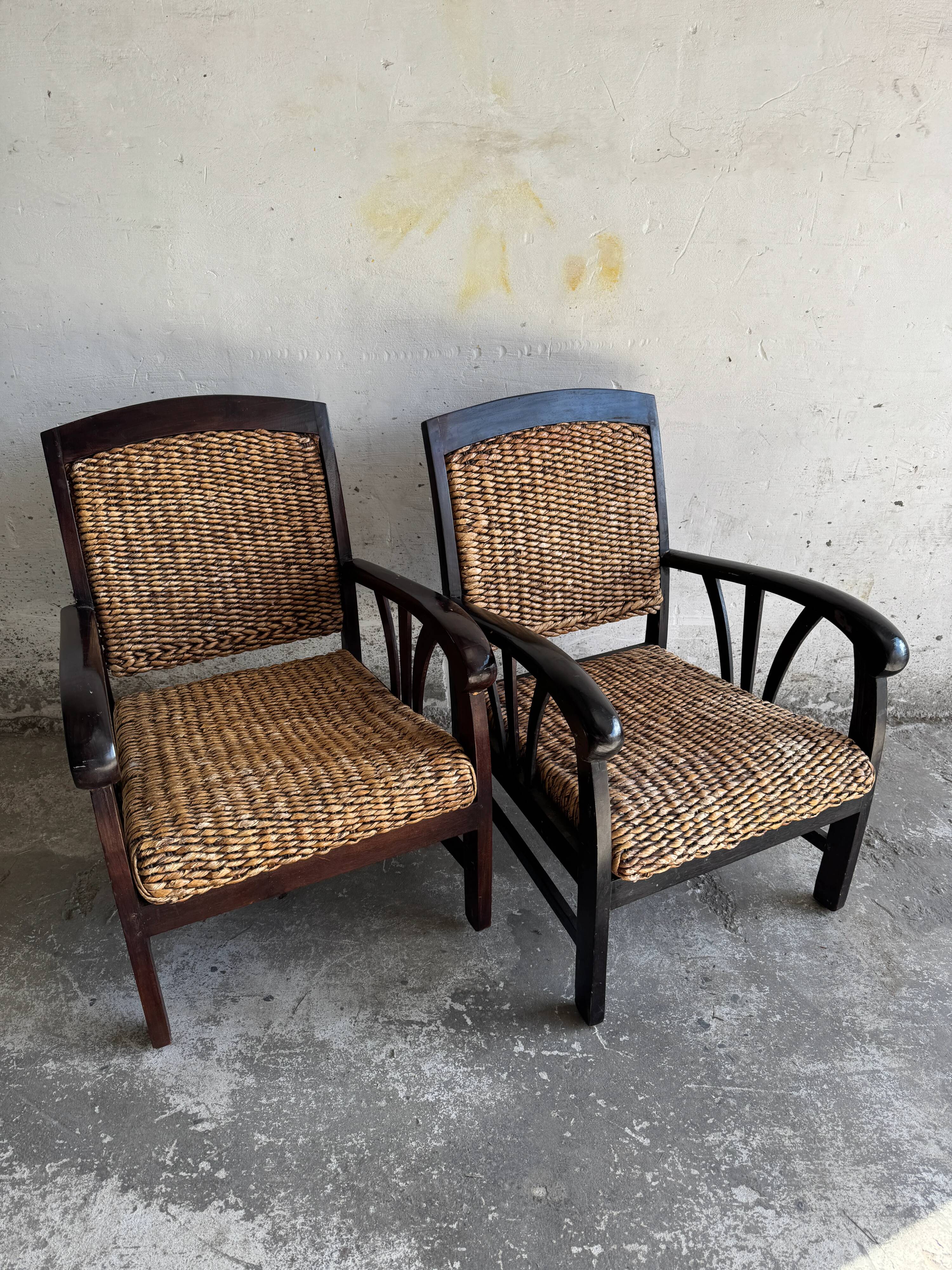 Set of two colonial dark-brown wooden armchairs with natural rattan seating (pair)