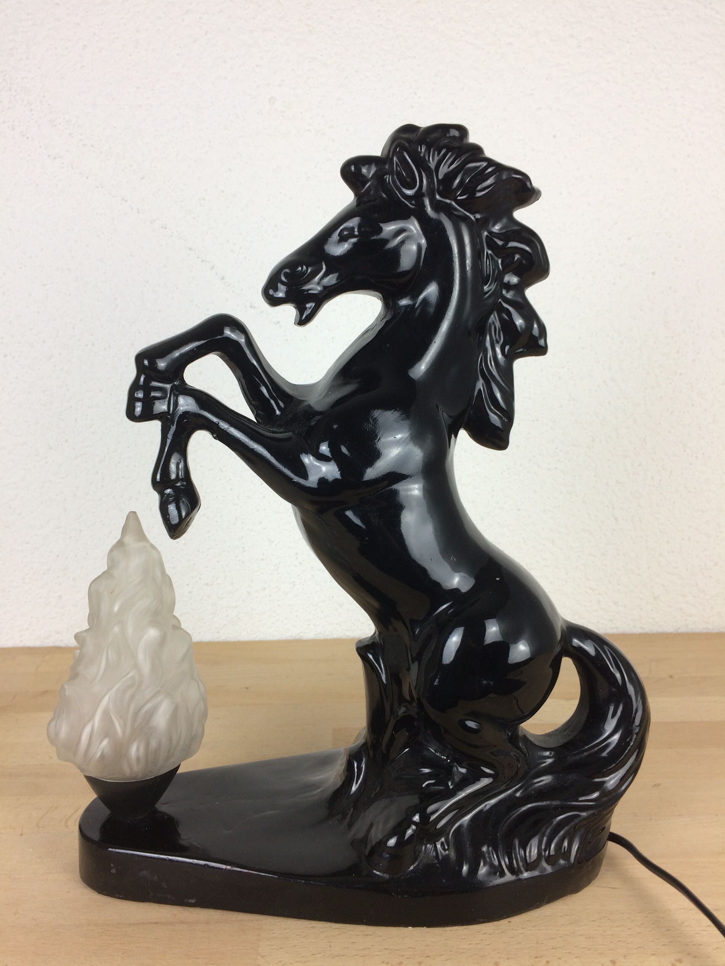 Prancing horse lamp and flame