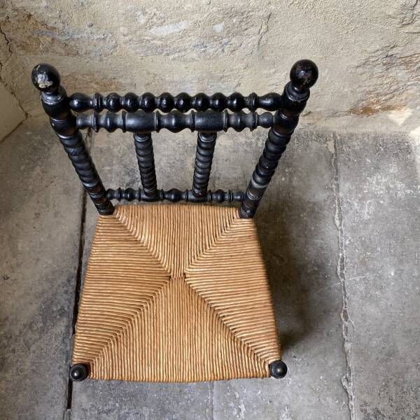 Low chair in turned wood