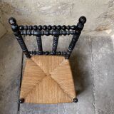 Low chair in turned wood