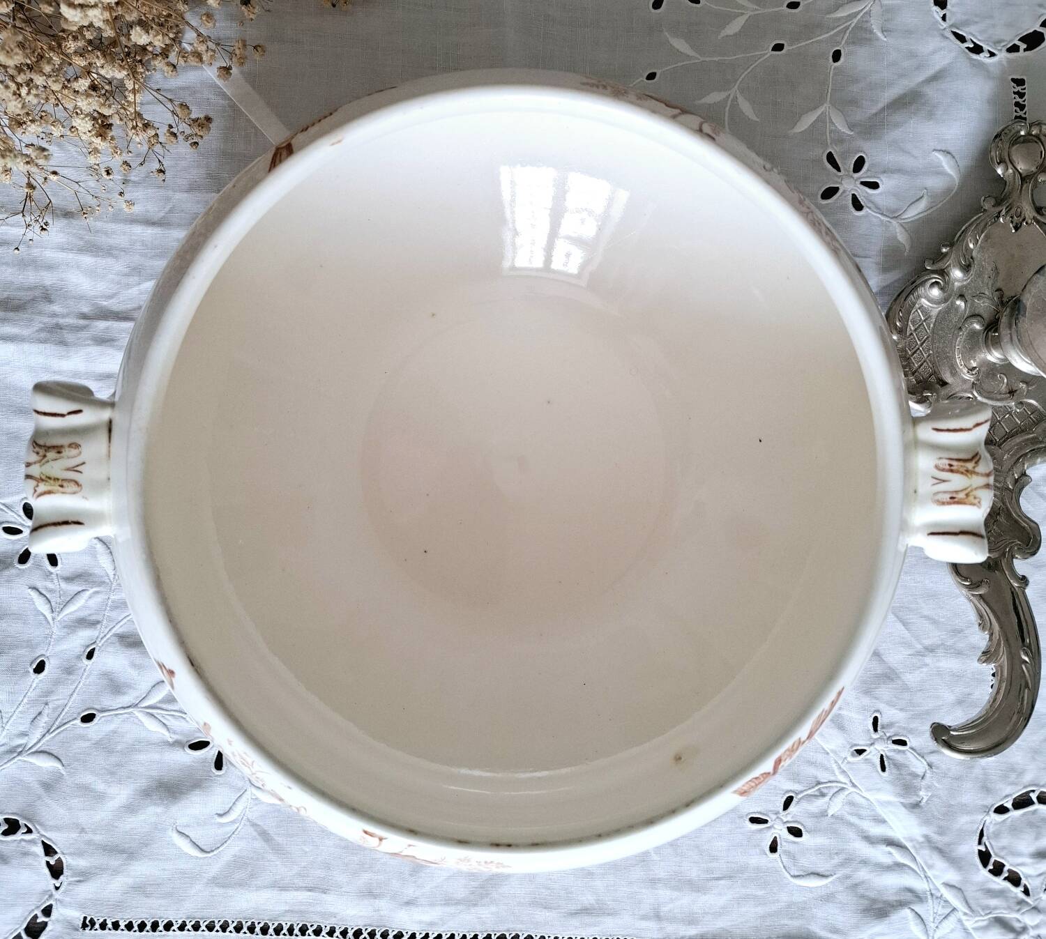 Antique iron earthenware plates accompanied by dishes