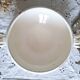 Antique iron earthenware plates accompanied by dishes