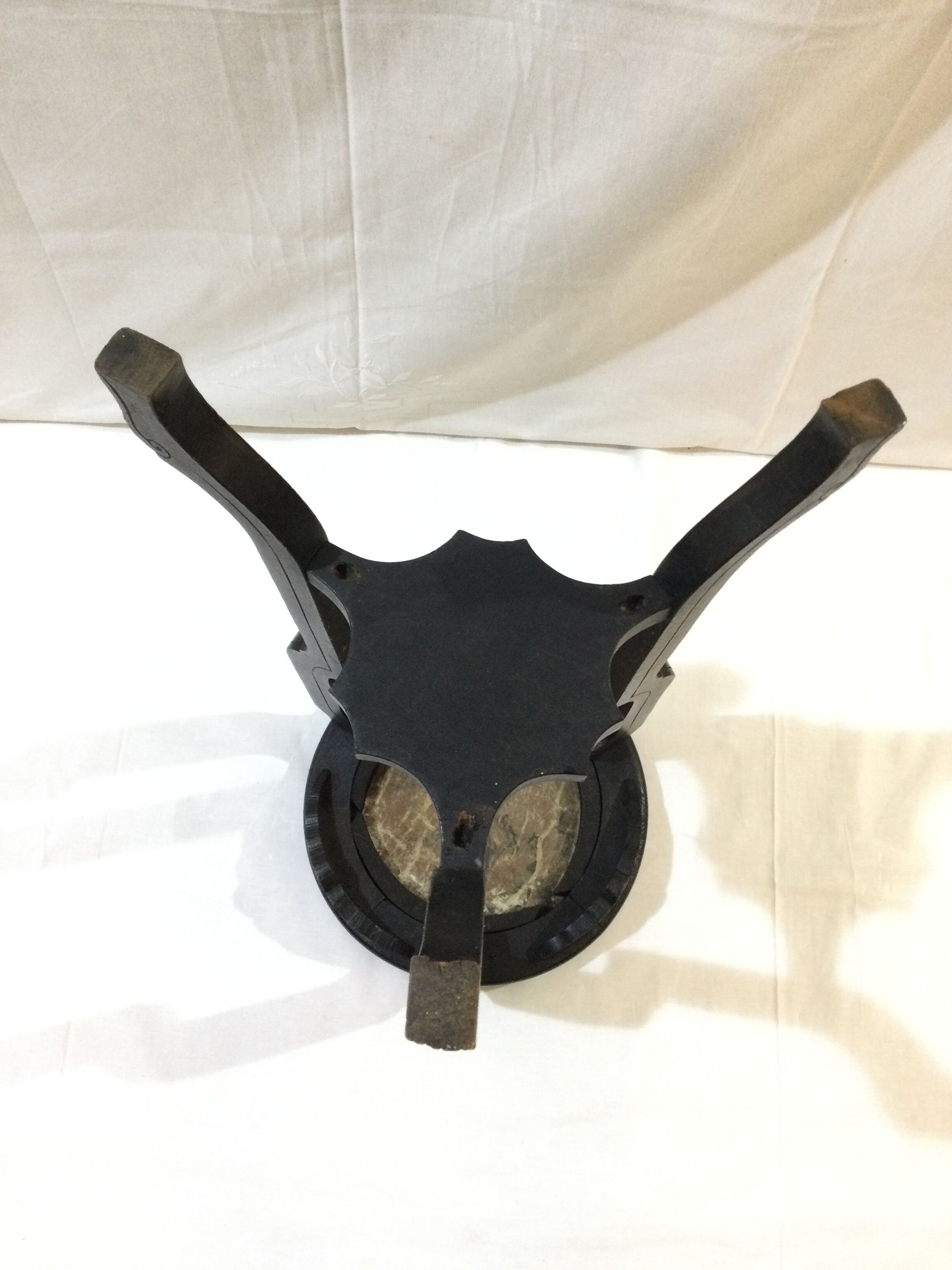 Blackened wooden and marble harness