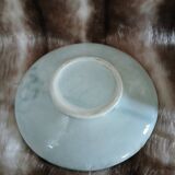 Antique cup and saucer in majolica.