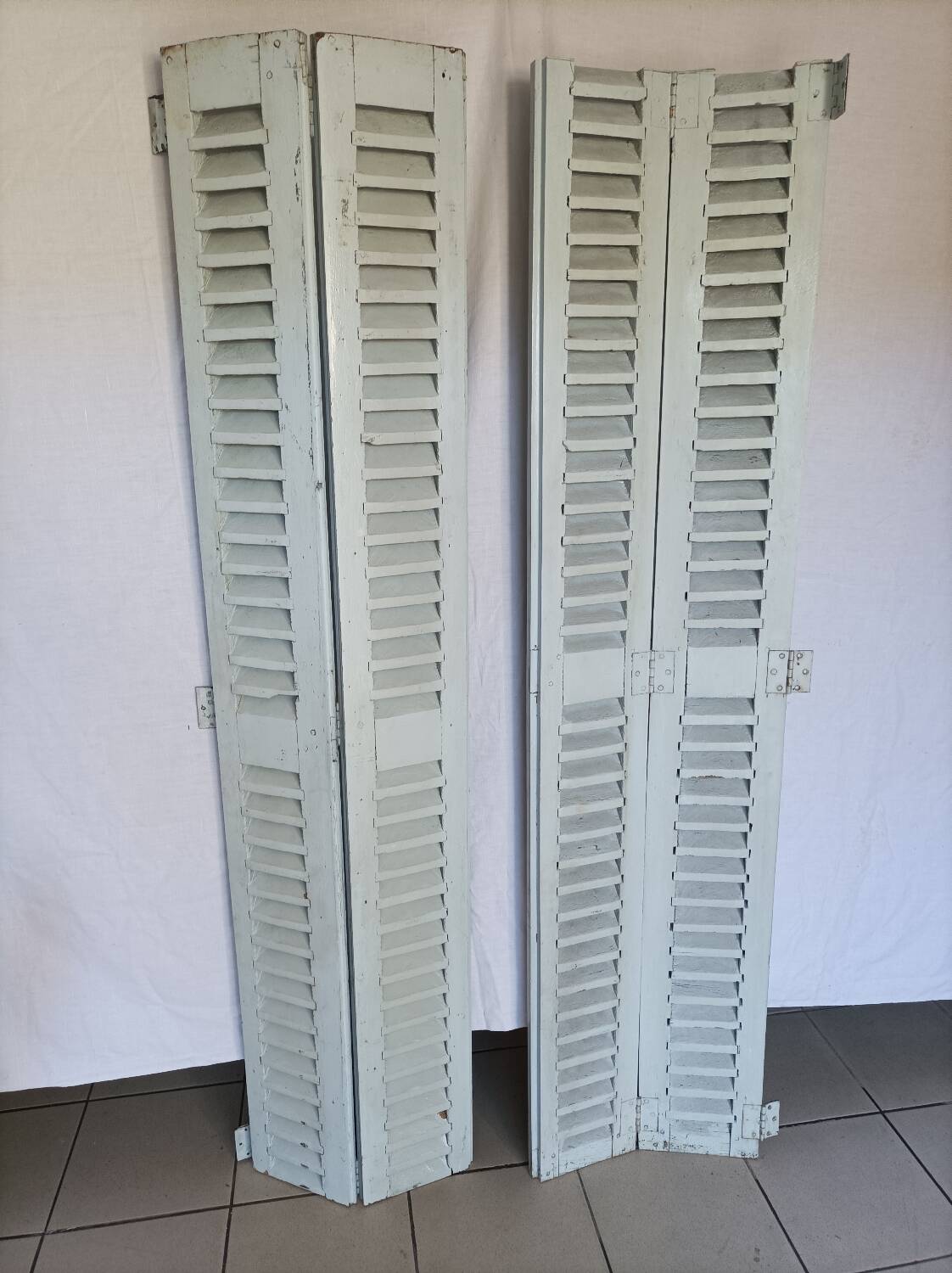 Louvered wooden shutter