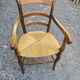 Cherry wood straw armchair