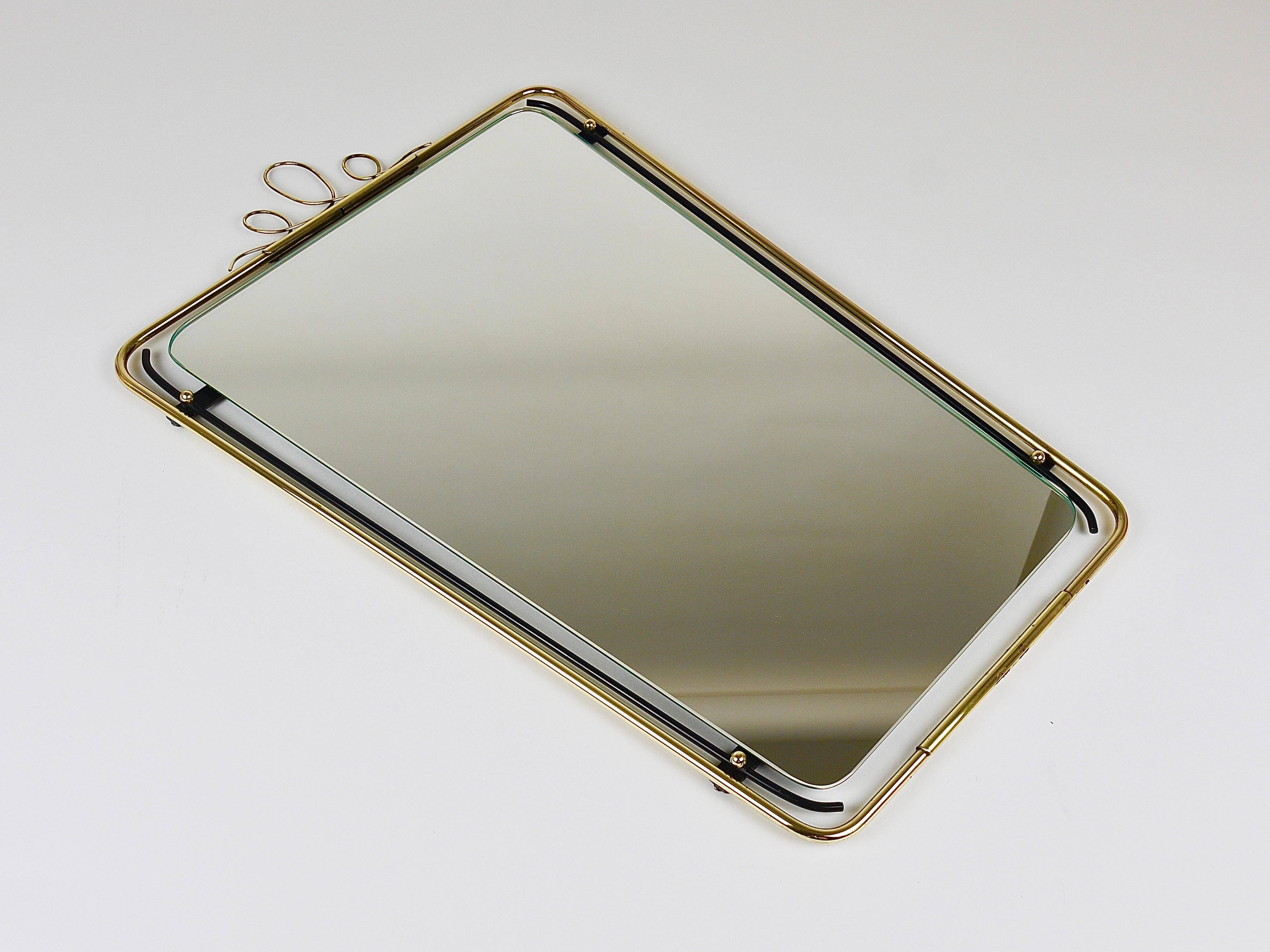Wall mirror in brass wire with modernist loops from the mid-century, Italy, 1950s.