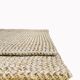 Handmade carpet in natural fiber of knitted palm leaf