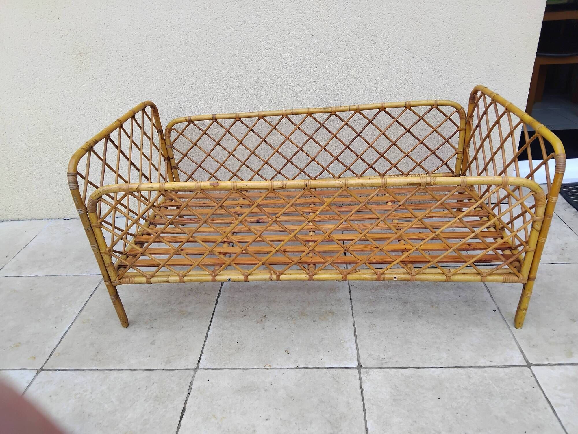 Vintage rattan child or baby bed
