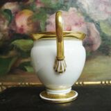 Tasse et soucoupe ancienne en porcelaine blanche et or XIXème avec poignée forme tête de cygne