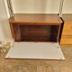 Large Scandinavian wall-mounted wood and aluminum bookcase circa 1960