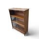Small antique wooden and glass display cabinet.