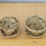 Pair of vergy speckled sandstone candle holders, vintage