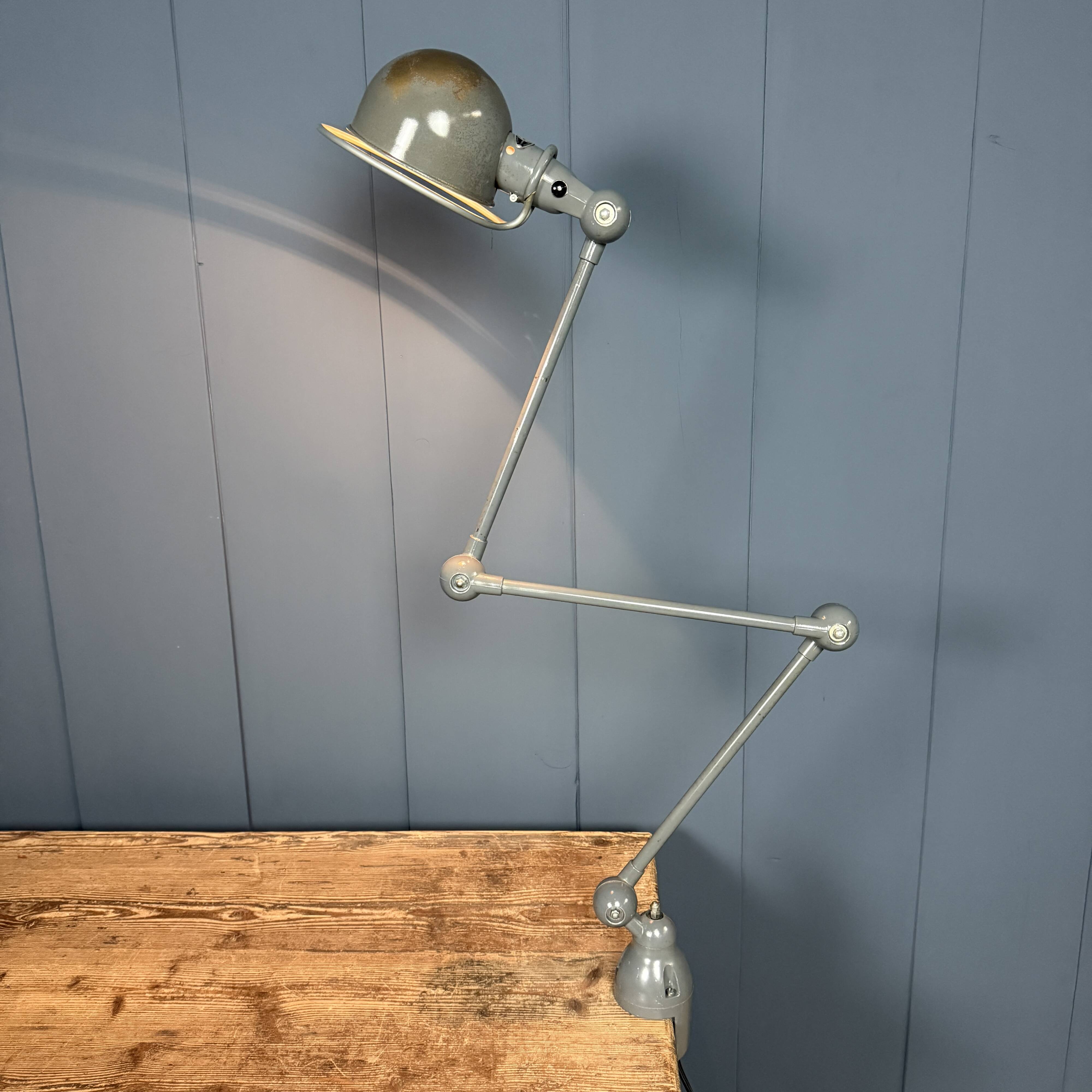 Dark grey Jielde three-arm clamp table lamp