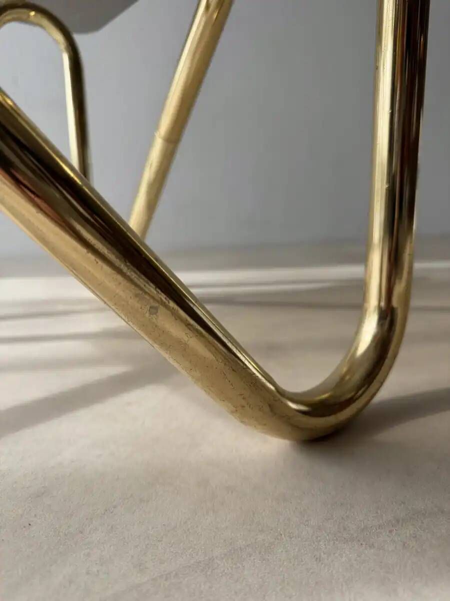 Coffee table with smoked glass and curved metal base