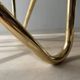 Coffee table with smoked glass and curved metal base