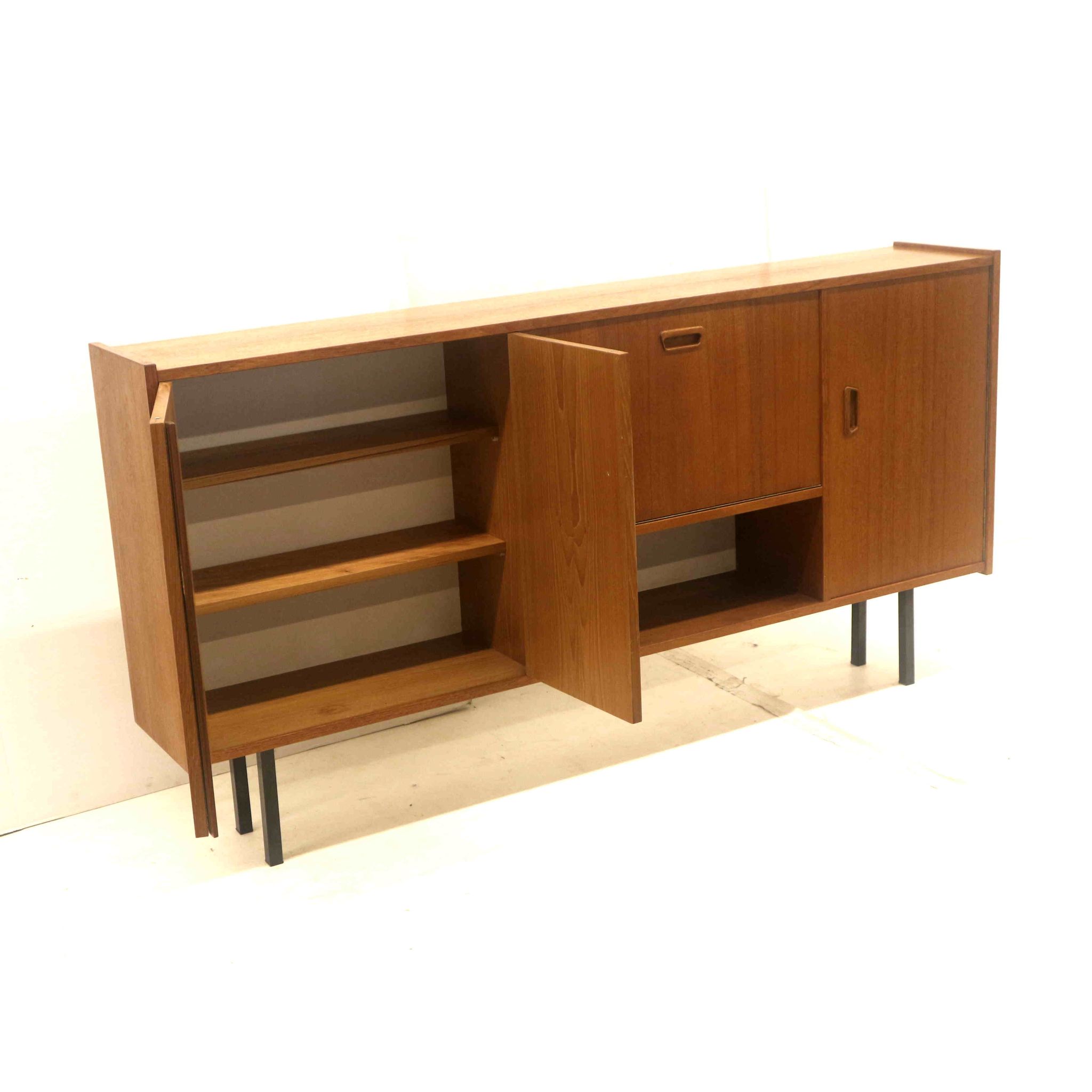 Vintage sideboard cabinet with beautiful handles on metal legs