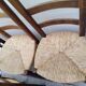 8 vintage straw chairs in the style of Charlotte Perriand.