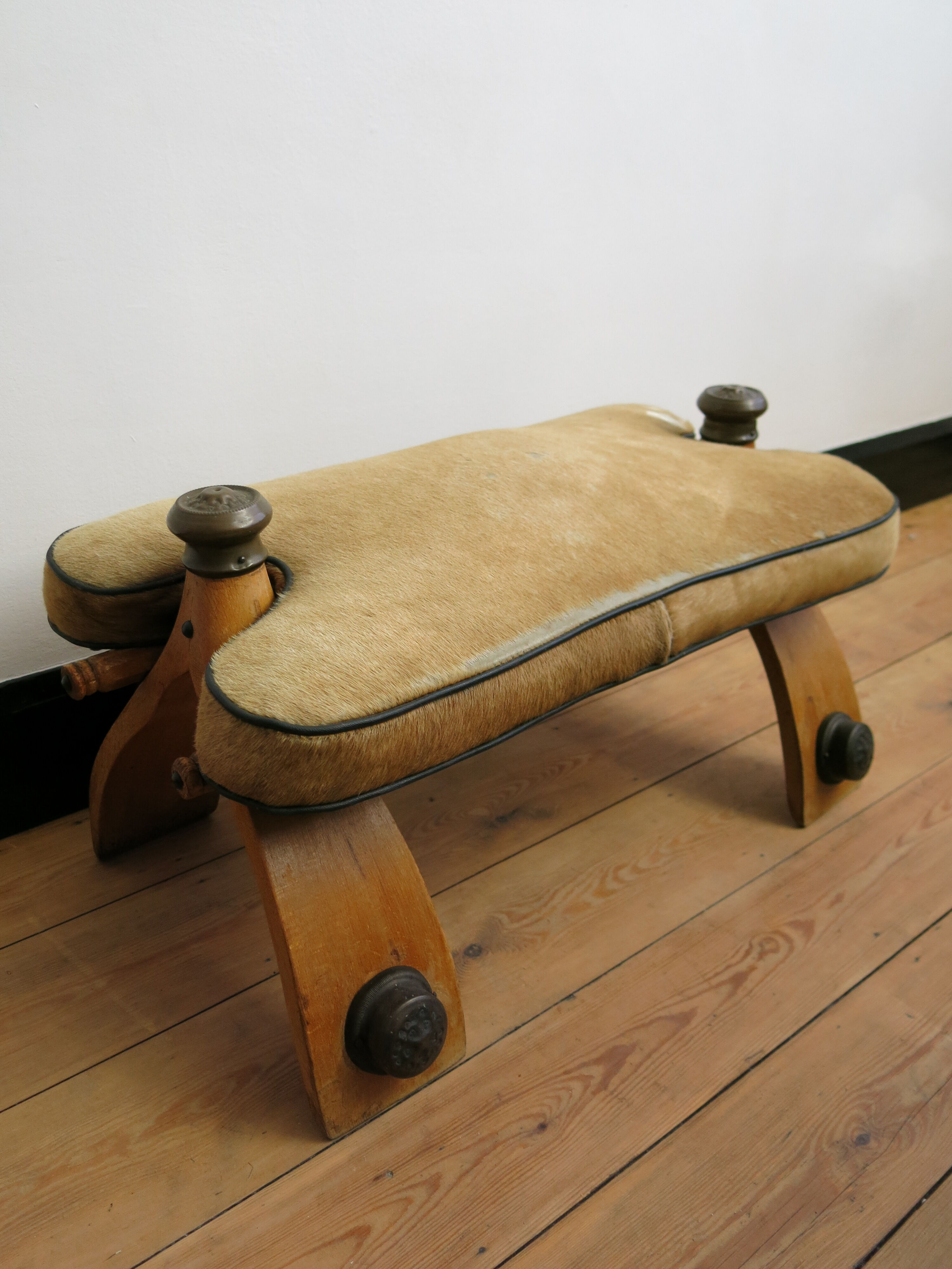 Camel saddle stool