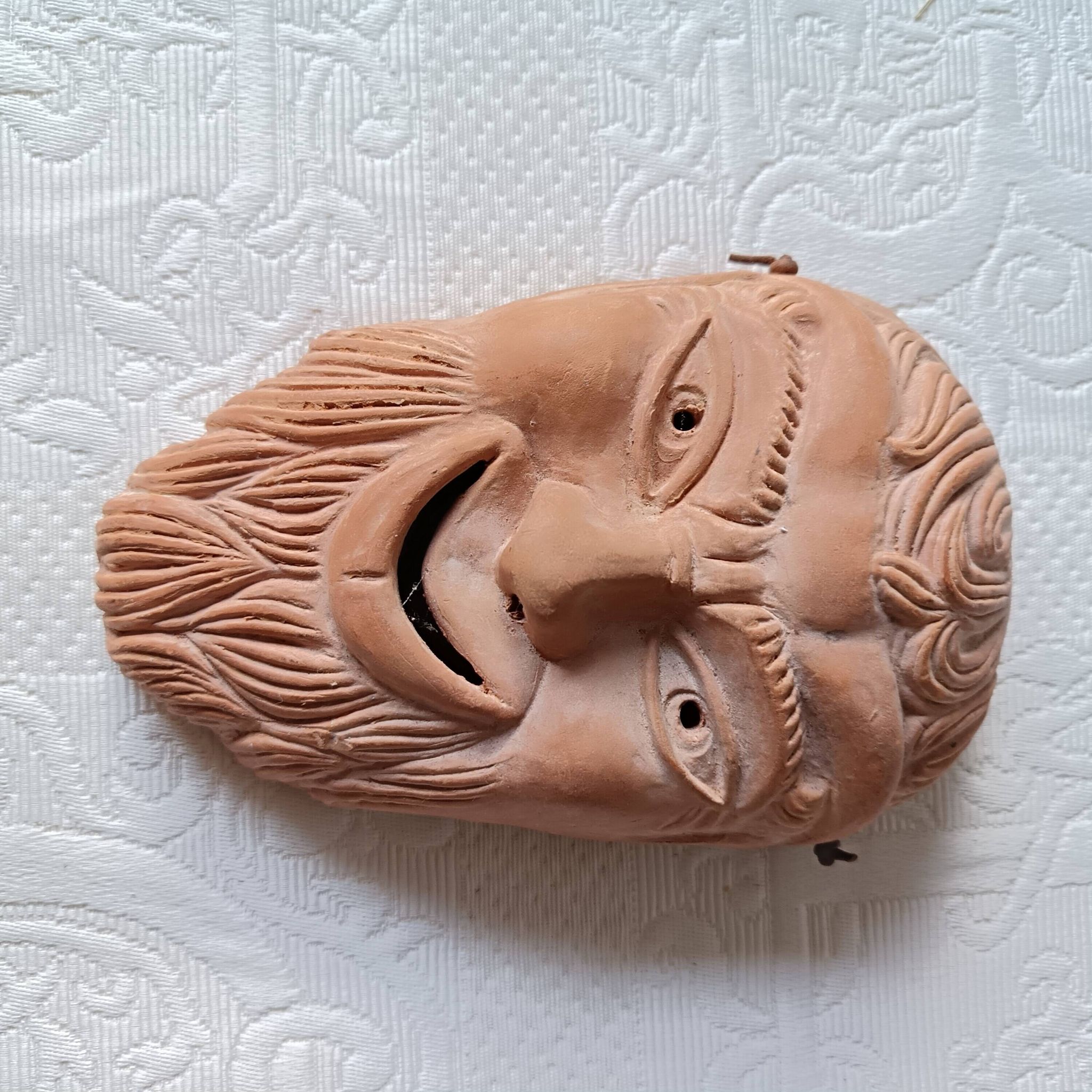 2 vintage terracotta masks made in Greece