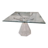 1980s table with a marble and steel base and a square glass top.