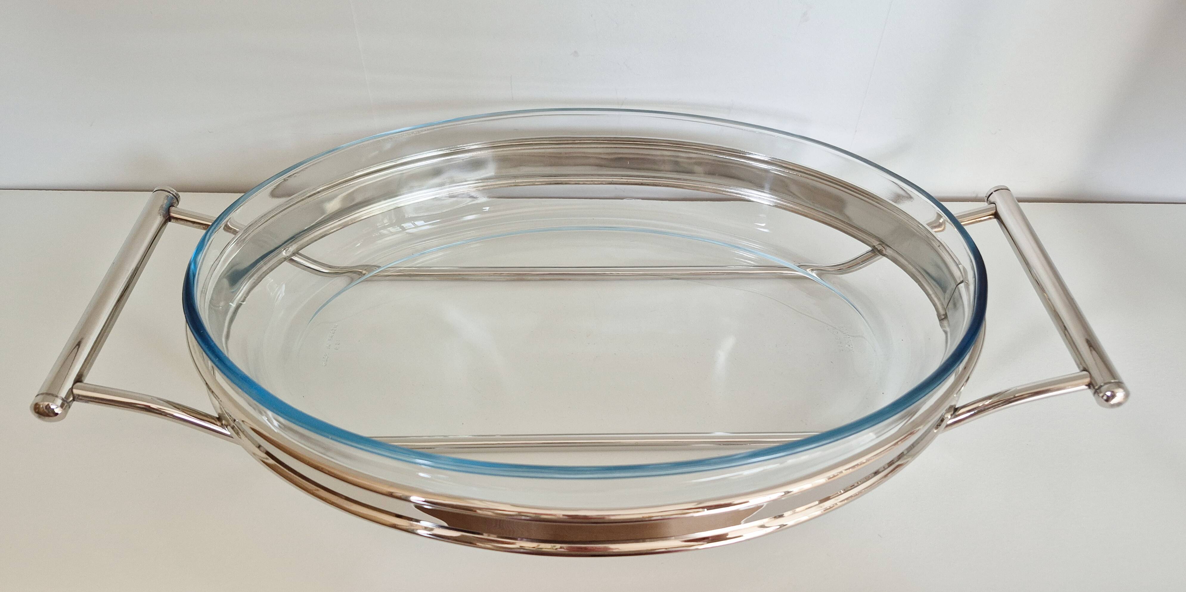 Oval Pyrex gratin dish, silver-plated metal stand.