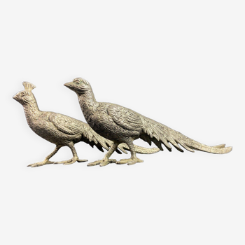 Pair of subjects with a couple of peacocks in silvered bronze