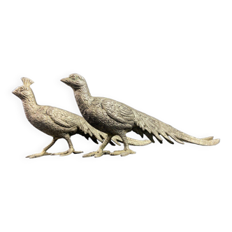 Pair of subjects with a couple of peacocks in silvered bronze