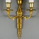 Set of three Louis XVI style wall sconces in gilded bronze, 20th century.