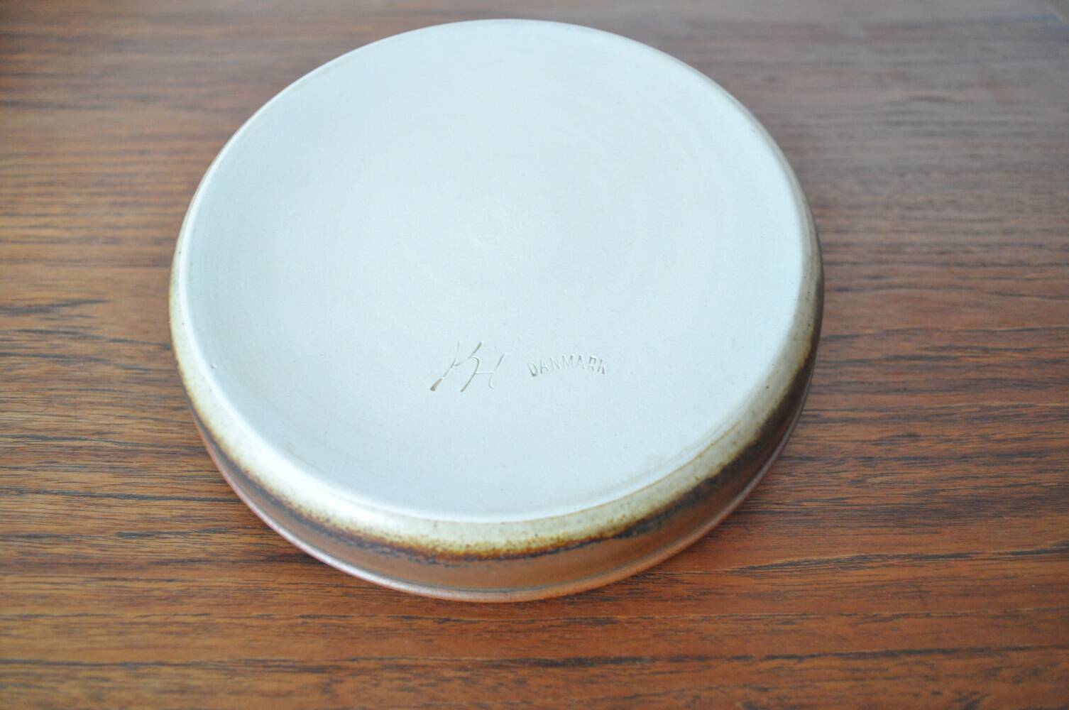 Candle holder made of stoneware with a harefur glaze