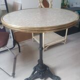 Genuine round bistro table, cast iron legs, brass rim