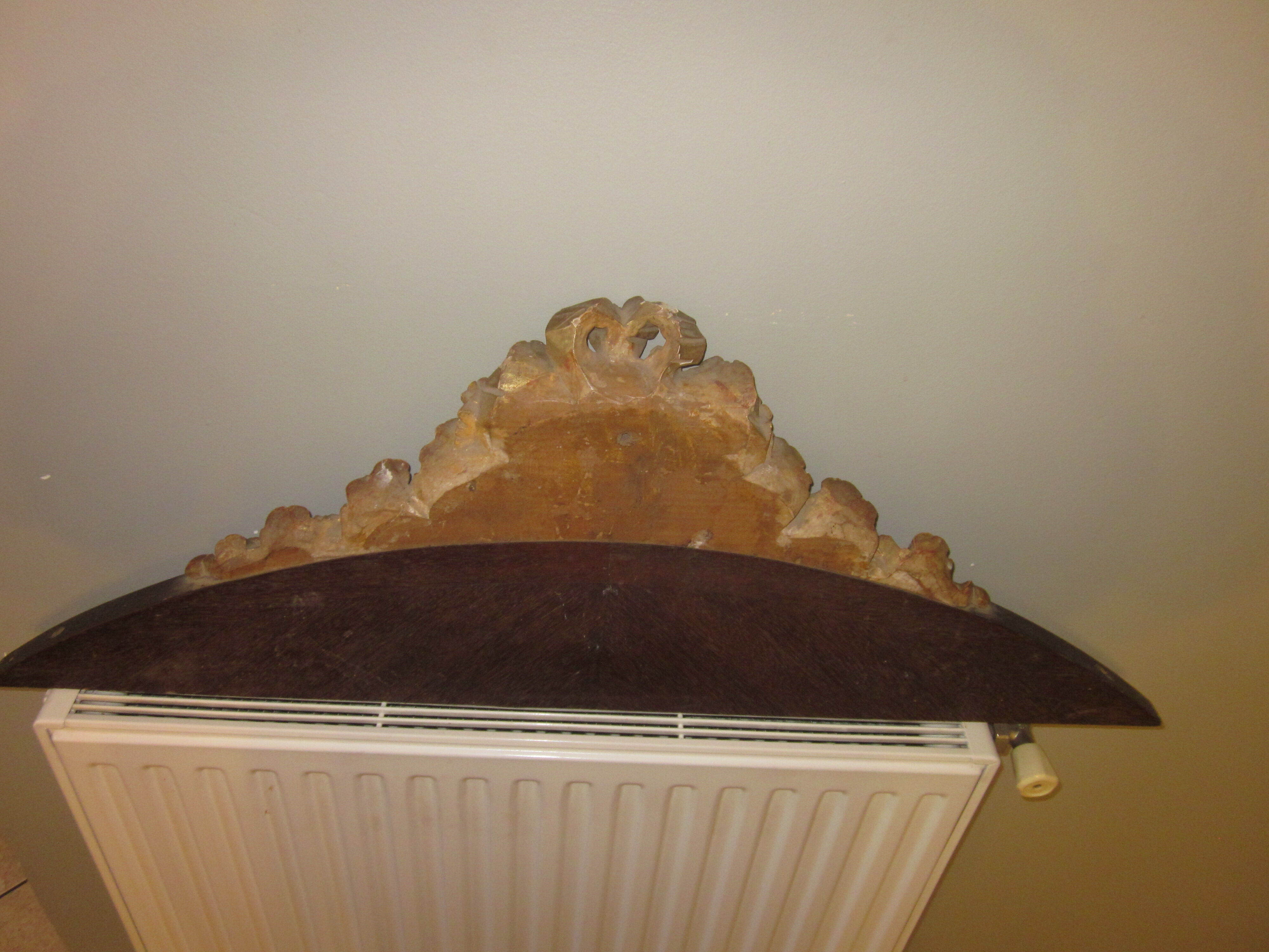 Old wooden pediment stucco