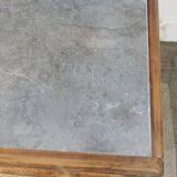 Vintage wooden buffet with a marble top.