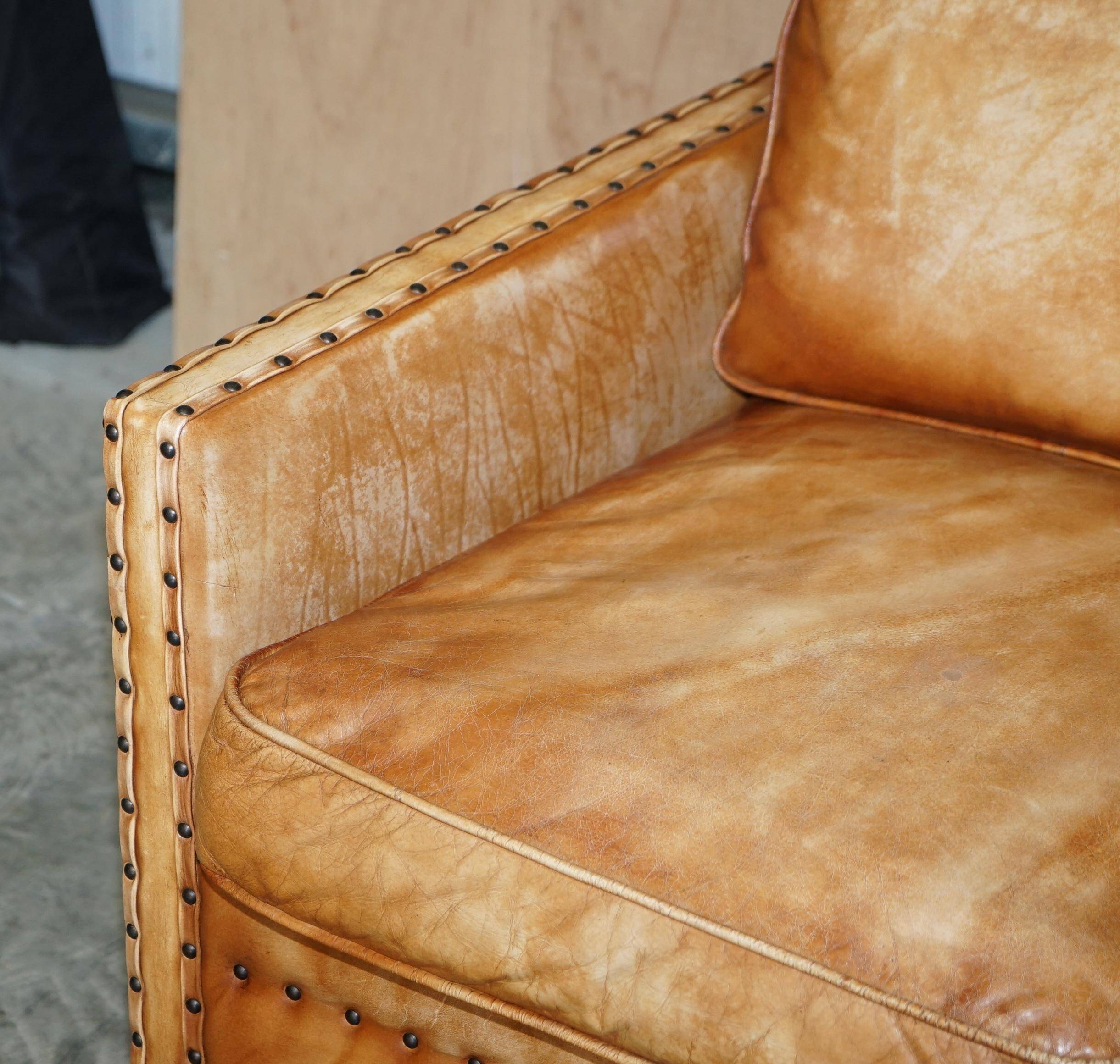 Two-seater leather canapé, hand-tanned, Edwardian style with studs.